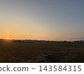 Japanese rural landscapes bathed in the setting sun and a vast blue sky 143584315