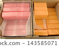 Natural handmade soap in pink and orange colors in boxes 143585071