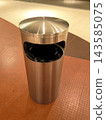 Modern stainless steel trash can in a public place 143585075