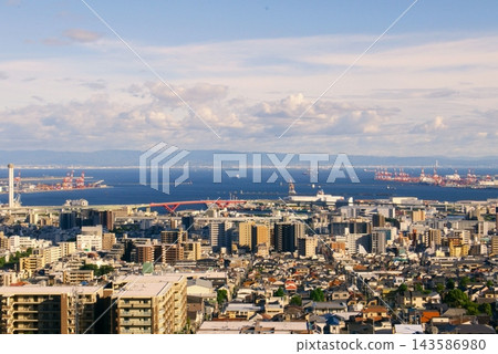 A panoramic view of the port city of Kobe from a hilltop. A panoramic view of the port city of Kobe from a hilltop. 143586980
