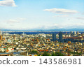 A breathtaking view of a vibrant cityscape and the blue sea. 143586981