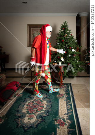 Traveler Santa standing beside luggage and Christmas tree 143587212