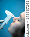 Close-up of caliper measuring patient's nose profile 143587241
