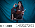 Woman reading a book, concentrating, studying, learning, focusing 143587253