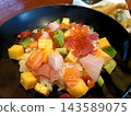 A vibrant seafood rice bowl 143589075