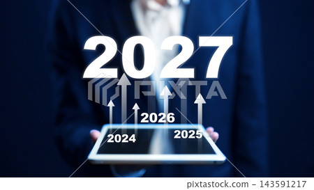 Growth projections for the years 2024 to 2027 using a digital tablet in a business setting 143591217