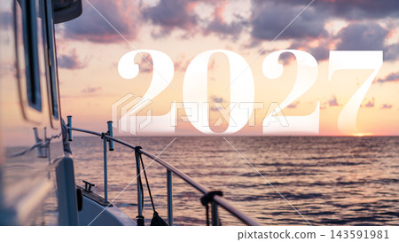 Sailing into the sunset in 2027 with calm waters and a beautiful sky Sailing into the sunset in 2027 with calm waters and a beautiful sky 143591981