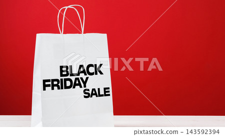Black Friday sale bag displayed against a red background Black Friday sale bag displayed against a red background 143592394