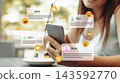 People engaging in social media chats and calls on a smartphone at a cafe 143592770