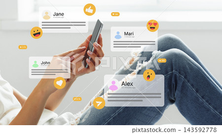 People chatting on social media while using phones at home in a casual setting 143592778