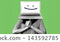 Person with a laptop on their head shows a smiley face in a playful setting 143592785