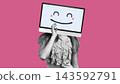 Person with a computer screen as a head smiles while holding a finger to their lips against a pink background 143592791
