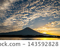 Mount Fuji and cumulus clouds as seen from Lake Tanuki 143592828