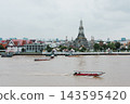 Bangkok, Thailand - June 11, 2025: Evening view of tourists watching the sunset along the Chao Phraya River at Wat Arun. 143595420