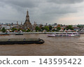 Bangkok, Thailand - June 11, 2025: Evening view of tourists watching the sunset along the Chao Phraya River at Wat Arun. 143595422