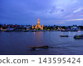 Bangkok, Thailand - June 11, 2025: Evening view of tourists watching the sunset along the Chao Phraya River at Wat Arun. 143595424