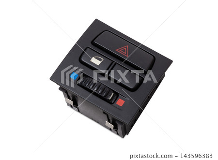 Black plastic block of car control panel with red emergency stop button for signal lights, spare part on a white isolated background in a photo studio for sale and installation in a auto service 143596383