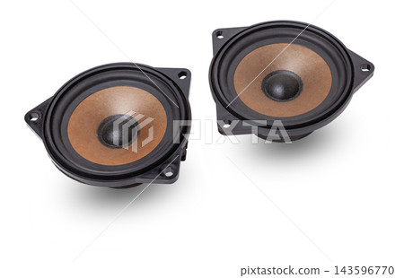 Two speakers of an acoustic system - an audio for playing music in a car interior on a white isolated background in a photo studio. Spare parts for auto repair in a workshop or for sale for tuning. 143596770
