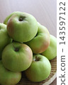 Green apples on a sieve 143597122
