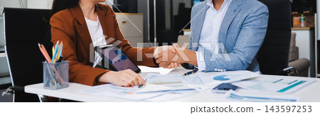 Business professional analyzing financial data on digital tablet dashboard with calculator and laptop, representing accounting software, ERP system integration, performance monitoring. Business professional analyzing financial data on digital tablet dashboard with calculator and laptop, representing accounting software, ERP system integration, performance monitoring. 143597253