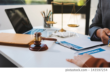 Businessmen or lawyers working together at a meeting, teamwork and partnership. Signing documents, contracts, checking details business agreement Businessmen or lawyers working together at a meeting, teamwork and partnership. Signing documents, contracts, checking details business agreement 143597254