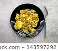 Homemade chicken rice pilaf with carrots and cabbage in black bowl, top view, healthy meal  143597292