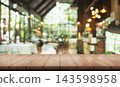Empty wooden table top with lights bokeh on blur restaurant background. 143598958