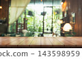 Empty wooden table top with lights bokeh on blur restaurant background. 143598959