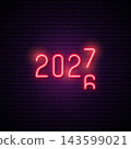 Bright neon numbers 2027 illuminated against dark wall, festive atmosphere 143599021