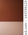 Minimalist brown background with a warm terracotta wall and beige surface, creating a clean and elegant backdrop for product photography. 143599129