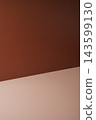 Minimalist brown background with a warm terracotta wall and beige surface, creating a clean and elegant backdrop for product photography. 143599130