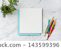 Top view of blank white and blue square greeting card with pencil mockup on marble background with copy space 143599396