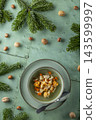 Hot chicken soup with vegetables and croutons on holiday table 143599997