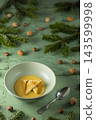 Pumpkin soup with croutons, nuts and fir branches 143599998