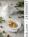 Christmas dinner fish soup with toasted bread 143600057