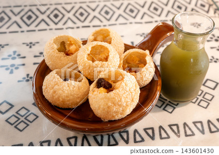 Spiced Sauce Crispy Fried Balls, Indian Spiced Crispy Balls, Indian Crispy Balls (panipuri golgappa) Spiced Sauce Crispy Fried Balls, Indian Spiced Crispy Balls, Indian Crispy Balls (panipuri golgappa) 143601430
