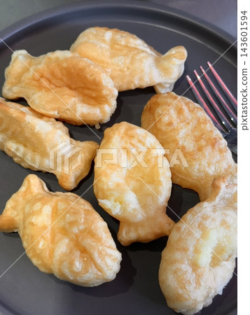 Crispy and golden mini bungeoppang with a soft, fluffy filling of sweet red bean or custard. A delightful bite-sized Korean fish-shaped pastry, perfect for a warm and nostalgic treat! Crispy and golden mini bungeoppang with a soft, fluffy filling of sweet red bean or custard. A delightful bite-sized Korean fish-shaped pastry, perfect for a warm and nostalgic treat! 143601594