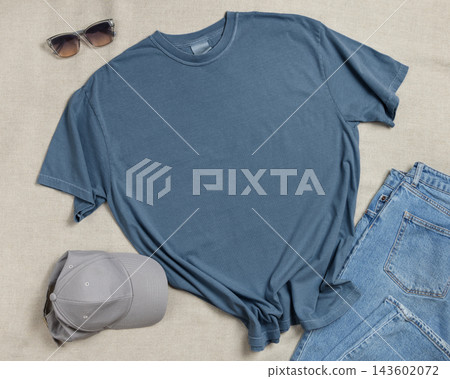 Blank washed blue unisex t-shirt mockup, crewneck flat lay with denim jeans and mens accessories Blank washed blue unisex t-shirt mockup, crewneck flat lay with denim jeans and mens accessories 143602072