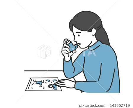 A female patient checks how to use the inhaler while looking at the instruction manual and then uses it. A female patient checks how to use the inhaler while looking at the instruction manual and then uses it. 143602719