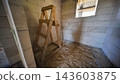 Unfinished corridor showing aerated concrete blocks and cement screed in a slavic village house 143603875