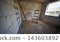 Unfinished room with wooden ladder and trestle during house construction process 143603892