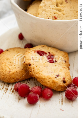 Cookies recipe. Crunchy dessert. Tasty traditional food baked with aroma natural ingredient. Healthy homemade snack with cranberries. Cookies recipe. Crunchy dessert. Tasty traditional food baked with aroma natural ingredient. Healthy homemade snack with cranberries. 143604013