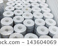 Stacked Decorative Wallpaper Rolls in Home Improvement Store 143604069