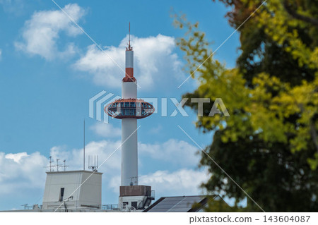 Kyoto tower and yellow leaves of ginkgo Kyoto tower and yellow leaves of ginkgo 143604087