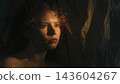 Introspective Woman Expressing Emotional Vulnerability in Dramatic Warm Light 143604267
