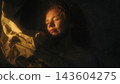 Woman With Hidden Identity Partially Concealed Behind Paper and Dramatic Shadows 143604275