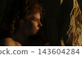 Curly Haired Woman Discovering Her Inner Self Through Light and Shadow 143604284