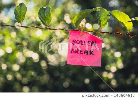 Paper note with SCREEN BREAK message against green leafy background. Suitable for digital detox, screen-free lifestyle technology break mindfulness. Paper note with SCREEN BREAK message against green leafy background. Suitable for digital detox, screen-free lifestyle technology break mindfulness. 143604613