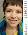 Close up portrait of 9 year old boy smiling happily looking at camera 143605432