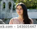 Portrait of attractive 34 year old woman without makeup showcasing natural beauty outdoors 143605447